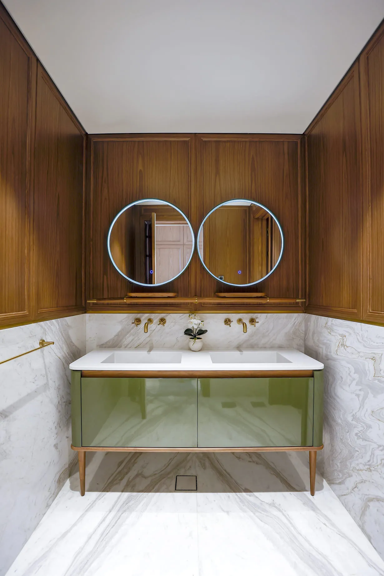 A well-equipped bathroom featuring two mirrors and a sink, offering convenience and functionality for everyday use.