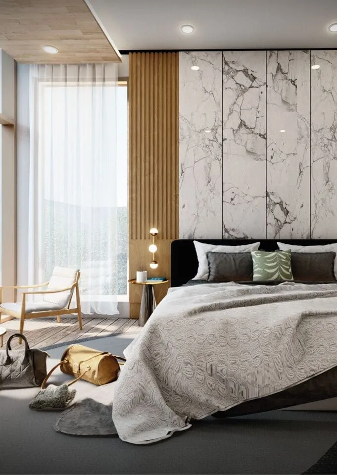A stylish bedroom with a sleek marble wall, creating a contemporary and elegant ambiance.
