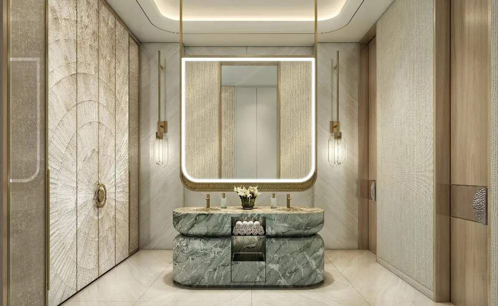 A luxurious bathroom with elegant marble counter tops and a sleek mirror.
