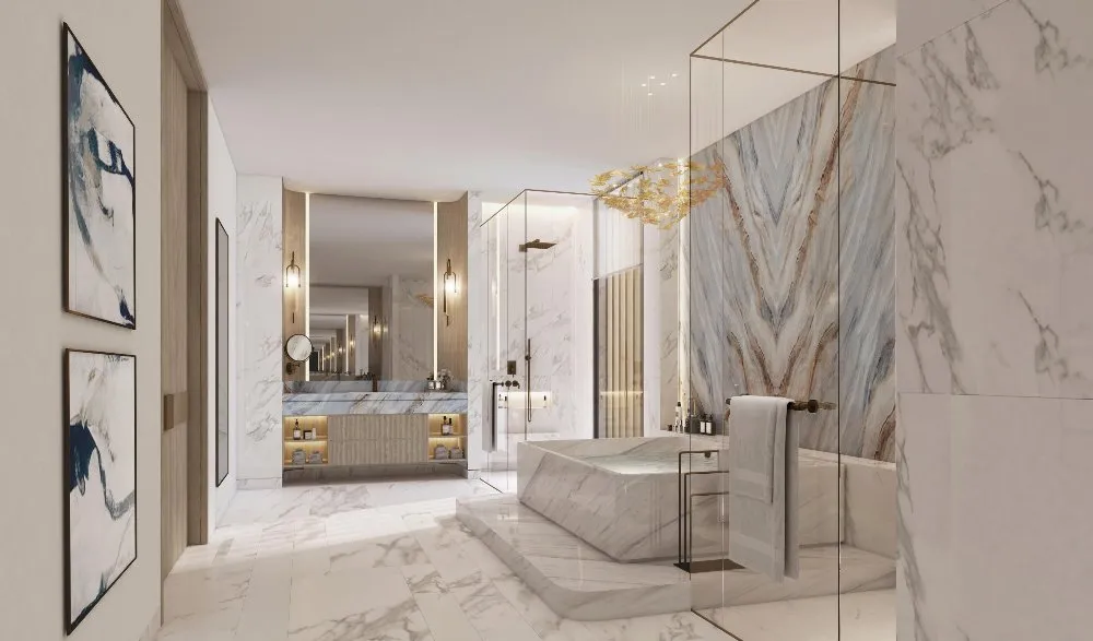 Luxurious bathroom with marble walls and flooring, creating a sleek and elegant atmosphere.